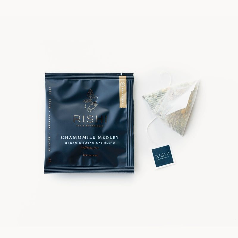 A bag of Chamomile Medley tea from Rishi Tea & Botanicals with a tea bag next to it.