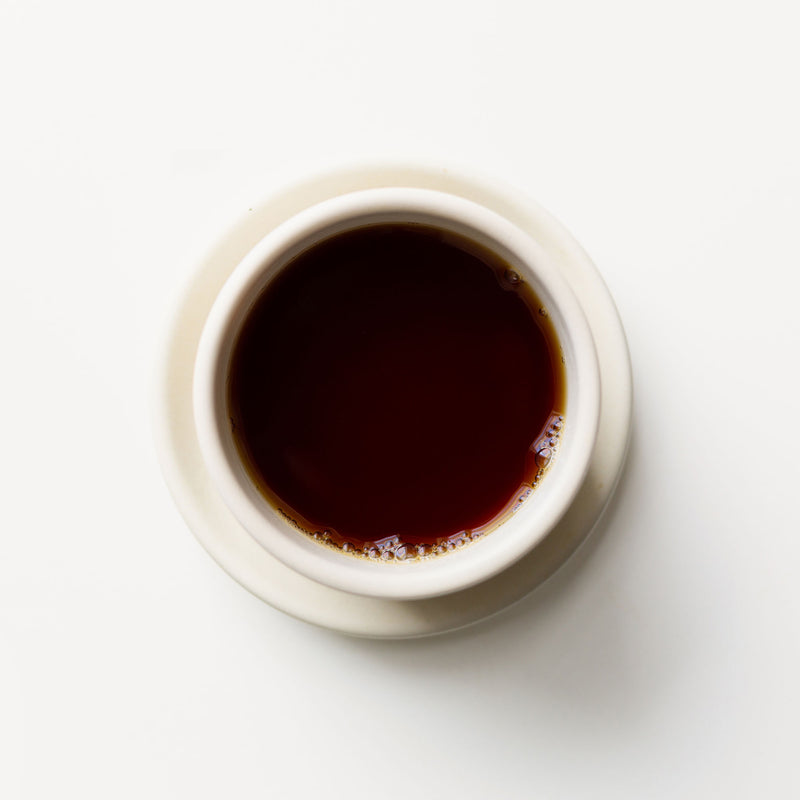 A cup of Golden Yunnan coffee on a white background from Rishi Tea & Botanicals.